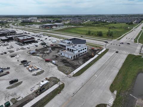 Kettlestone Social under construction with Waukee neighborhoods visible on the horizon